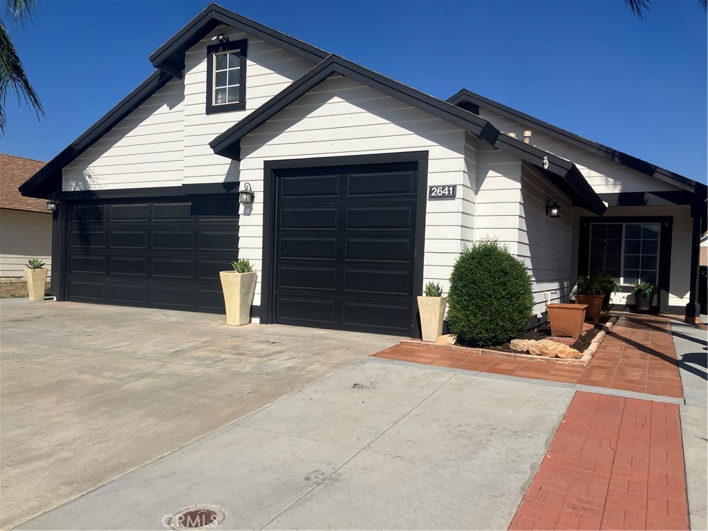 Welcome to this 3 bedroom and 2 bath early 90s built single story home. This lovely property in located in a quiet and nice area of the city of Perris. The home presents you with a unique 3 space car garage and welcoming exterior color scheme making the layout of the home stand out. As pull up to the home you will see nicely kept driveway with lovely red bricks making the front yard stand out. As you walk into the home you are welcomed by nice high cathedral ceilings and spacious open floor with well maintained tile floors all throughout the home. The kitchen has decent counter space with beautiful green cabinets. The family room has enough space for those family gatherings to entertain, it also has beautiful french doors guiding you to the backyard. The main bathroom has a double sink with shower. All bedrooms have the ideal space to feel comfortable. The backyard is full of privacy and has cover patio to enjoy your morning coffee. Come see it now!!