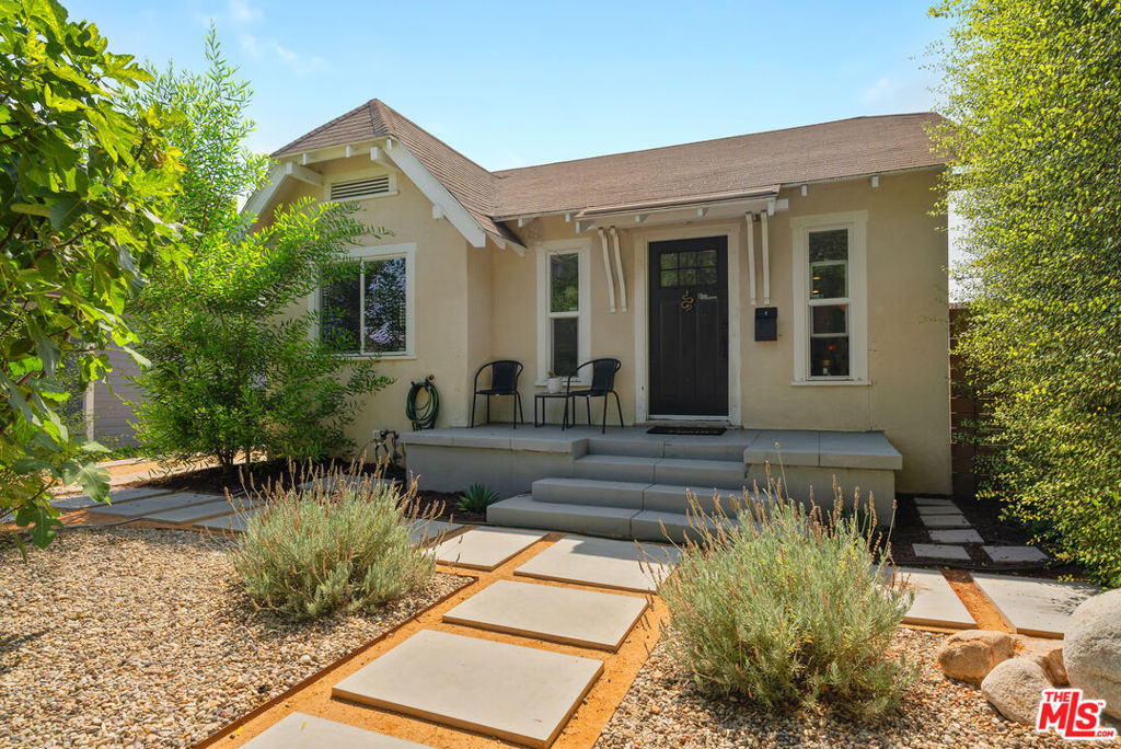 Welcome to this beautifully remodeled 4-bedroom, 2-bathroom residence nestled in the heart of the iconic Leimert Park neighborhood of Los Angeles, rich with cultural history and architectural charm near the former homes of music legends like Ella Fitzgerald & Ray Charles. This property blends classic elegance with today's comforts. Owners have updated the home, the landscaping, and even earthquake retrofitted the house in 2021. From the moment you arrive, you'll feel embraced by the private yard that boasts drought-tolerant landscaping and modern fencing installed in 2021, with a modern paver walk-path, a widened driveway, a mature olive tree, privacy screening, and a celestial Fig tree. You'll be captivated by the character-filled charm of the cozy living room that leads you into a large kitchen featuring a dining room, updated flooring, and abundant natural light streaming through the energy-efficient, dual-pane windows. The living room showcases the home's original 1920s charm with its original archway leading to a modernized open-concept kitchen with tons of cabinets and storage, ideal for entertaining, and features a new quartz countertop and herringbone tile backsplash, PLUS all new appliances installed in 2022. The front bathroom was updated in 2021 with stylish tile flooring, new hardware, vanity, and storage; and the separate laundry room, also updated in 2021, features a new, energy-efficient, side-by-side, large-capacity washer and dryer, cabinetry, and storage. With 4 bedrooms and a large backyard, this home is ideal for so many. All bedrooms offer abundant light and plenty of space. The primary bedroom has its own ensuite bathroom boasting period-appropriate flooring, and has been partially updated with a new facility, and is located at the rear of the home, offering privacy and a peaceful escape. Backyard features plenty of space to take in the beautiful LA weather and, along with modern paverwalk paths, a large sitting area for entertaining, a garden, a mature lemon tree, and fruit-producing blue java banana trees. Centrally located with quick access to ALL of LA's main freeways (the 10, 405, 110, 101, 90) and conveniently located to both the Metro Line running through Westwood and ending in Santa Monica, and the new K line running to LAX.DTLA, Culver City, and the Westside beaches are easy access as well as Silverlake, Echo Park, and Pasadena. This home is a rare opportunity to live in one of LA's most storied neighborhoods while enjoying all the conveniences of modern living.