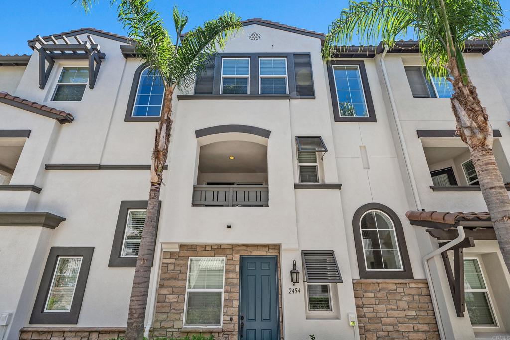 Welcome to this stunning townhome built in 2014 and located in desirable West San Marcos bordering Carlsbad. Incredible amenities make you feel like you are on a permanent vacation, and feature two sparkling pools, soothing spa, 4 BBQ grills and dining tables, playground, and lush tropical landscaping. Inside, the home boasts a modern design with versatile spaces. The first floor includes a "Flex Room" perfect for an office, playroom, gym, or guest suite—complete with a closet and access to the two-car garage with overhead storage racks. The second floor is a perfect gathering space, featuring an open concept living area. The upgraded kitchen is a chef’s dream, with granite countertops, a breakfast bar, stainless steel appliances, a beautiful backsplash, and gorgeous cabinetry. This level also includes a convenient half bath and sliding doors that open to a covered patio where you can relax and enjoy partial poolside views while sipping your morning coffee or evening beverage. Upstairs, the primary suite offers a walk-in closet and an ensuite bathroom with a step-in shower. Two additional guest bedrooms share a well-appointed bathroom with a tub/shower combo. A full-size washer and dryer are conveniently located in the hallway closet. This home exudes warmth and style with newer carpet, laminate wood flooring, and fresh paint added in 2024. Beautifully designed lighted ceiling fans in the kitchen and bedrooms add both function and charm. Located within a highly rated school district, close to shopping and dining, and a short drive to the beach, this townhome offers the perfect combination of comfort, convenience, and coastal living. It’s truly a wonderful place to call home!
