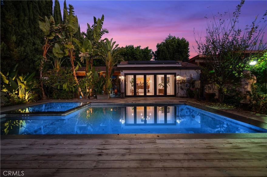 Welcome to this exceptional Sherman Oaks retreat that seamlessly blends luxury living, versatility, and resort-style amenities on an expansive, private lot. Designed for both elevated everyday living and unforgettable entertaining, this one-of-a-kind property offers a rare combination of space, style, and income or multi-generational potential. The main residence is filled with natural light, high ceilings and thoughtfully designed living areas that flow effortlessly from indoors to out. Generous living and dining spaces create an inviting atmosphere, perfect for hosting or relaxing in comfort. The kitchen serves as the heart of the home, ideal for gathering and entertaining with ease. A standout feature of the property is the private ADU, complete with its own kitchen and a sleek glass walk-in shower—perfect for extended family, guests, a home office, or additional rental income. Step outside to discover a massive, show-stopping backyard that feels like your own private resort. Enjoy an infinity pool as the centerpiece, surrounded by multiple lounge areas designed for relaxation and entertainment. A dedicated gym space, private BBQ area, and an inviting outdoor fireplace lounge create the ultimate setting for year-round enjoyment, from lively gatherings to peaceful evenings under the stars. Adding to the property’s versatility is a large private driveway offering ample parking for multiple vehicles, with potential for RV or boat parking, a rare and valuable feature in this area. Located in one of Sherman Oaks’ most desirable neighborhoods, just minutes from top dining, shopping, and easy freeway access, this property offers a rare lifestyle opportunity that truly has it all—luxury, flexibility, and an entertainer’s dream outdoor experience. This is more than a home—it’s a destination!