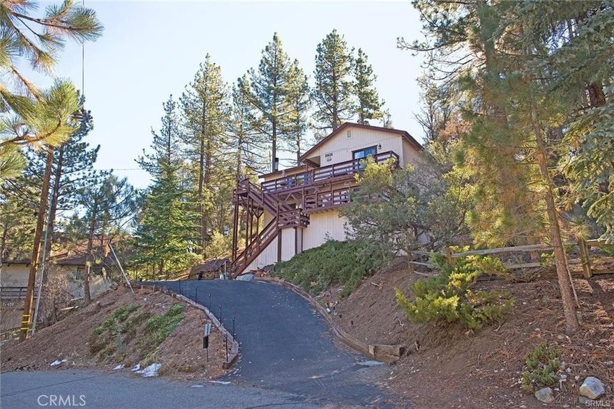 Are you looking for a totally upgraded home? It has Central Heat, wood burning stove w/ used brick hearth in the greatroom, but it also has a pellet stove downstairs, they also added brand new central Air conditioning. The home has seperate living areas and entrances, enter upstairs to a Vaulted ceiling Great Room besides the wood burning stove, the great views are out every window. The kitchen has new granite counters, new appliances, Custom built wet bar, they is newer laminate flooring in Dining Area and Kitchen w/ new Kitchen cabinets & custom tile backsplash a reverse osmosis and a roomy walkin pantry. Also on this floor is 2 master bedrooms/ bathrooms w/ marble vanities and a laundry room with stainless steel Samsung Appliances. Head downstairs to another family area, yet another master suite,bathroom, w/ a pellet stove for those cool evenings, walk-in closet, and opens to the front deck. There is also a bonus room on this floor, that is currently being used for bedroom 4, and from this bonus room is 2 storage rooms. A whole-house water softener,  security camera system, 2 Ring security cameras and a generator. All this plus the wonderful decks for entertaining provides you with mountain living at your finest. You must see this special home.