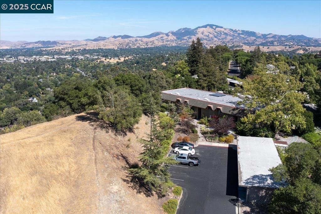 Discover the perfect blend of casual comfort and contemporary style in this spacious, private Piedmont retreat, a tucked-away townhouse on a peaceful Skycrest knoll in Rossmoor’s premier 55+ community. With level-in access just steps from the carport, this end-unit, 3-bedroom, 2.5-bath co-op offers effortless living and sweeping views of iconic Mt. Diablo. Inside, you’ll find a freshly painted interior, updated kitchen and baths, a mix of hard-surface flooring and brand-new carpet, plus an expansive covered patio with extra living space and a large storage closet, all surrounded by serene views. Highlights you’ll love include an oversized primary suite with long-range views, two full baths upstairs plus a convenient en-suite half-bath on the main level, a full-size stacked washer/dryer, built-in microwave, and generous closet space on the over-sized patio. A close carport and ample guest parking complete the picture. Spacious, private, and move-in ready—this is the perfect place to relax, entertain, and embrace the Rossmoor lifestyle. Welcome home!