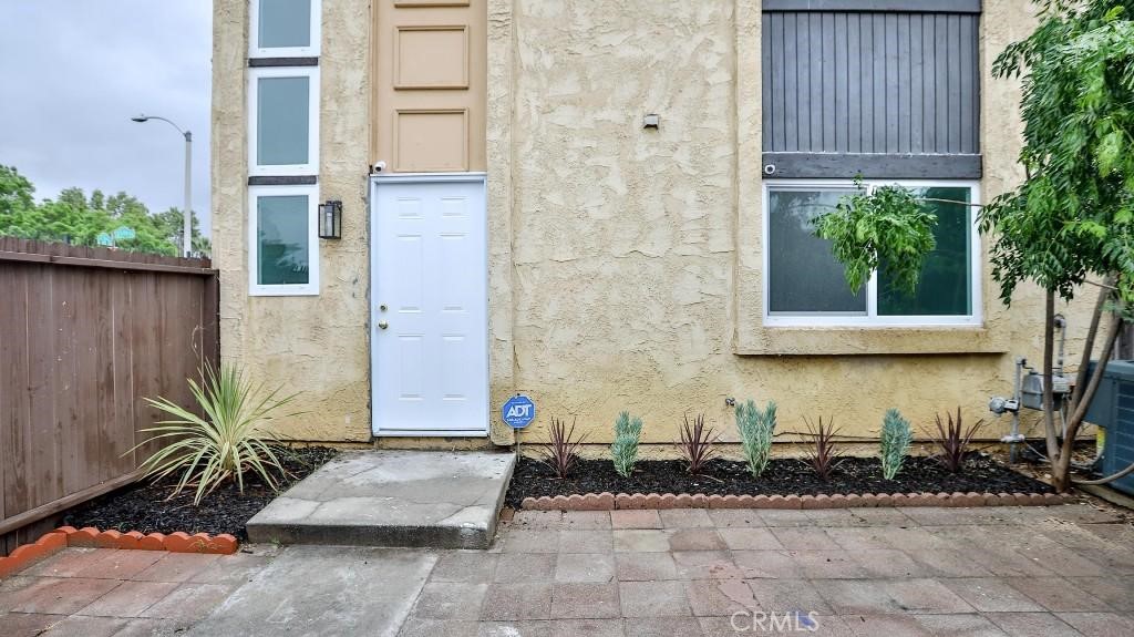 Step into this stunning, completely remodeled condo, offering 4 bedrooms and 2.5 baths in a highly desirable neighborhood! From the moment you walk in, you'll be greeted by a beautiful new centerpiece that sets the tone for the elegance throughout. The brand-new kitchen boasts custom white cabinets, quartz countertops, new appliances, and recessed lighting, creating a sleek and modern cooking space. Throughout the home, vinyl flooring adds a contemporary touch, while new windows, fresh paint, and updated doors enhance its charm. Every bathroom has been thoughtfully redesigned, complemented by new closet sliding doors for a refined look. Outdoors, enjoy gorgeous paver flooring in the front yard, a spacious backyard, and new landscaping for curb appeal. Plus, the HOA is undergoing a transfer and will be rehabilitating all common areas in the near future, adding even more value! Located near top-rated schools and major freeways, with 2-car parking in the carport, this condo is an incredible opportunity for comfortable and stylish living. Don't miss out! House is virtually staged. Seller is motivated, open to credit to buyer some of buyer's closing cost!