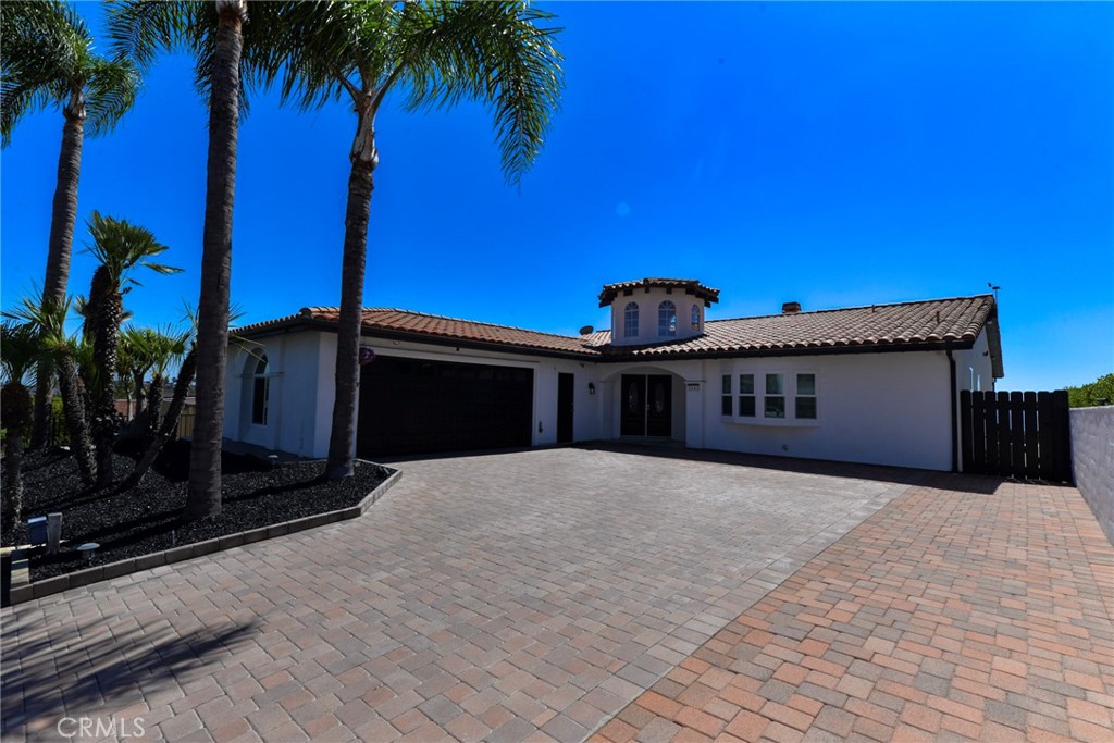 Welcome to your dream coastal retreat in the heart of San Clemente with 3381 sq ft, 4-bedrooms and 4-bathrooms. This stunning two-level home offers panoramic ocean views, luxurious indoor-outdoor living, and a layout designed for both relaxation and entertaining. This unforgettable property combines style, comfort, and coastal charm in one exceptional package. Step inside to soaring vaulted ceilings with exposed wood beams and wide-plank light oak-style flooring that bring warmth and character to the space. A sparkling crystal chandelier in the entryway sets the tone for the home's elegant design, while a second chandelier in the formal dining room adds a refined ambiance perfect for hosting dinner parties. The main level features a spacious primary suite with high ceilings, a spa-inspired bathroom with a soaking tub, walk-in shower, and generous walk-in closets with two extra bedrooms and baths. The living area offers a cozy fireplace, perfect for cool evenings, and oversized sliding glass doors that open to expansive ocean views and flood the space with natural light and fresh coastal air. Washer/dryer hook-ups in hallway near garage. The kitchen is bright and functional, featuring a built-in refrigerator and adjacent bar area—perfect for casual meals or entertaining guests. Downstairs, you’ll find an entertainer’s paradise, complete with a built-in bar and mini fridge. A bonus room on this level provides the perfect space for a home gym, yoga studio, office or creative studio—with views of the ocean to inspire you daily. Two large ocean-facing decks, one on each level, offer ample space for outdoor living—whether it’s lounging in the sun, enjoying al fresco meals, or watching the sun dip into the Pacific each evening. A two-car garage and an oversized driveway provide plenty of parking, and the home’s ideal location in one of San Clemente’s most sought-after neighborhoods puts you just minutes from beaches, shops, and dining. This is more than a lease—it’s a lifestyle. Coastal luxury, endless views, and timeless design await.
