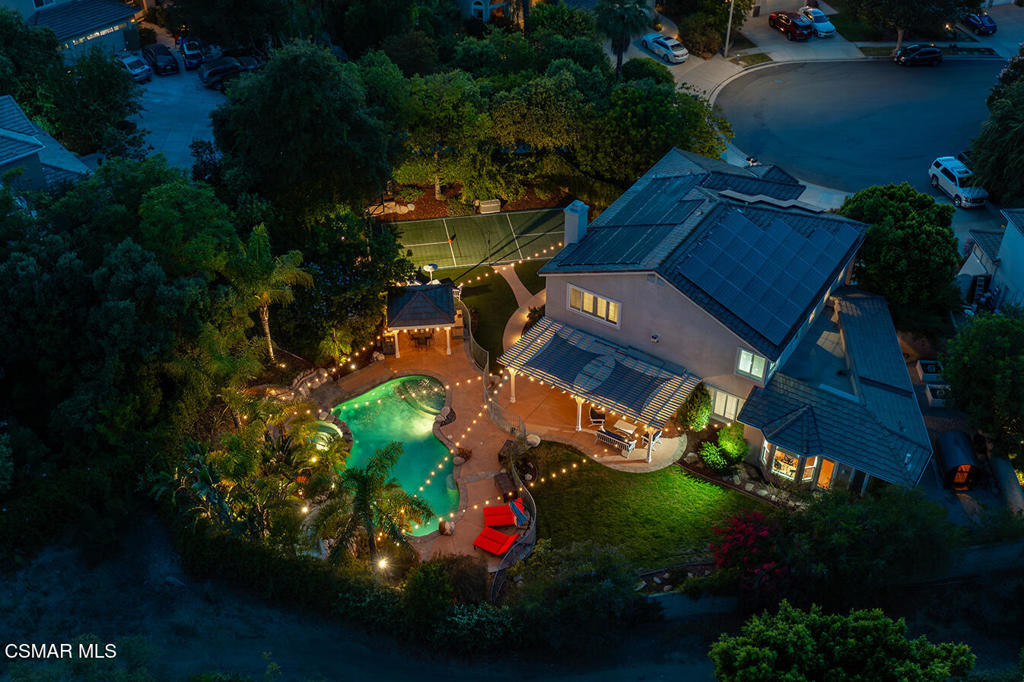 Most homes are a chapter - this one is the whole story.Tucked away at the end of a serene cul-de-sac in Wood Ranch's coveted Valley View Estates, welcome to 206 Shady Hills Court, a nearly 4,000 square foot residence that embodies both luxury and livability. Set on a flat ⅓-acre lot, this rare model property blends thoughtful design with resort style amenities, offering a true indoor outdoor lifestyle.Inside, the home features 5 spacious bedrooms and 4 bathrooms, with a layout designed for comfort and flexibility. The main floor includes a beautifully remodeled kitchen with modern finishes, a generous bedroom suite with an attached full bathroom, and a sprawling 800+ sq. ft. game/guest suite complete with its own kitchenette, full bath, steam shower, and private access to the backyard. Upstairs, the primary retreat and three additional bedrooms provide a perfect balance of space and privacy. A three zone HVAC system ensures climate control efficiency throughout the home, while the three car garage with two Tesla chargers adds practical convenience.The backyard features a resort style pool with slide and solar heating, a large BBQ area with a full size outdoor fire place, and a full size electric sauna. Active living comes alive with a private sport court, ideal for basketball or tennis, and the large grassy area framed by multiple mature fruit trees offers both shade and charm. The property is maintained with ease thanks to a Wi-Fi enabled smart sprinkler system, ensuring lush grounds year round.Beyond the home itself, Valley View Estates enriches the experience with access to a private lake that allows fishing, beautifully maintained greenbelts, and common areas. This prime Simi Valley location is also close to Wood Ranch Golf Club, award-winning schools, Rancho Madera Community Park, hiking trails, shopping, and dining.206 Shady Hills Court isn't just a home - it's a lifestyle and a place where every detail has been carefully crafted for comfort, connection, and endless enjoyment.https://www.206shadyhillscourt.com