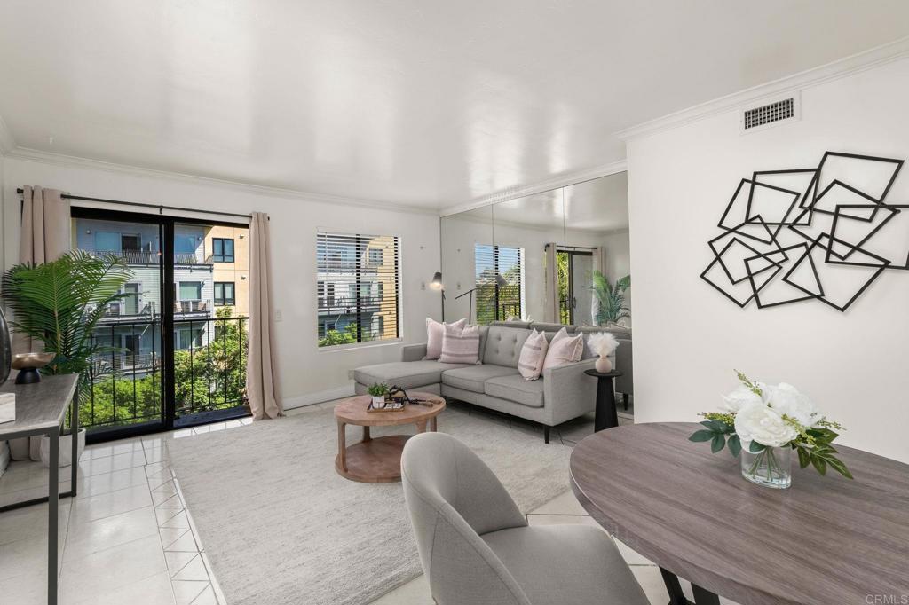 Experience bright, top-floor living at 1650 8th Ave #401, a rare corner unit condo in the sought-after Cortez Hill neighborhood of Downtown San Diego. This light-filled 1-bedroom, 1.5-bath home features an open floor plan, in-unit washer/dryer, secure underground parking, and one of the lowest HOA fees downtown, an incredible value for city living. A community rooftop terrace is the ideal place to watch planes land and take in the surrounding views. Located in a VA-approved community, this home offers exceptional walkability to restaurants, cafés, Petco Park, and Balboa Park, plus quick freeway access for an easy commute. Whether you’re a first-time buyer, a downsizer, or simply looking for an affordable alternative to renting in Downtown San Diego, this property checks all the boxes. Don’t miss your chance to own a top-floor condo in one of downtown’s most charming neighborhoods. Schedule a tour today and discover why Cortez Hill is one of San Diego’s best-kept secrets.