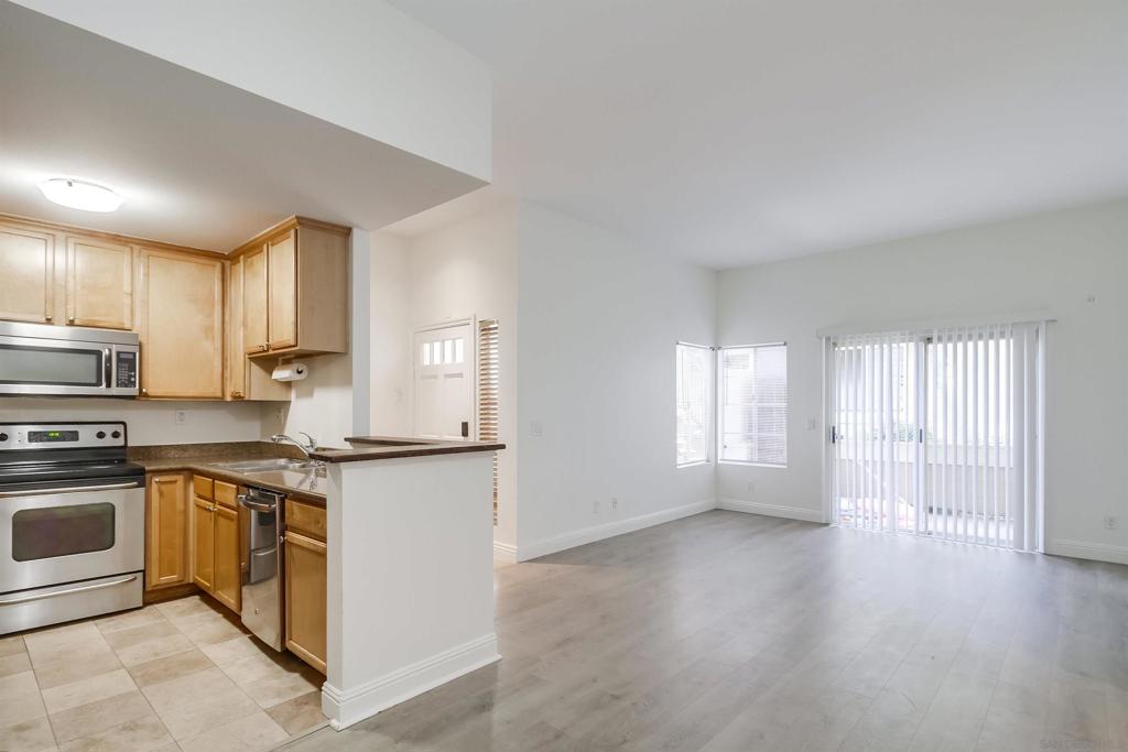 Welcome to this rarely available 3 bedrooms and 2 bathrooms within 1,088 square feet bottom-floor condo with two parking spots & plenty of guest parking in the Village Walk community. Enjoy modern living with updated flooring, and an open-concept design that seamlessly connects the living, dining, and kitchen areas. The kitchen is equipped with granite countertops and ample cabinet space. The master suite boasts a private bath and walk-in closet with built-in shelving. Community amenities include a communal pool, hot tub, security gate, and an exercise room. With an adjacent playground, this home offers convenience and leisure, all within a gated community designed for an exceptional lifestyle. Discover the perfect blend of comfort and modern living in this community.