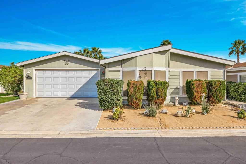 Beautiful 55+ Gated Community with panoramic views of surrounding mountains, One of the largest homes & located in the newest section at Desert Sands Mobile Home Park. Triple wide with 2 car garage. Spacious living room/den, family room. The dining room area & Kitchen have laminate flooring. Ceiling Fans thru-out. Light & bright with lots of windows... The master bedroom is wall-to wall glass windows looking out to the greens. Lush large side yard with lots of privacy your own little paradise in your backyard. French doors that lead to a covered patio back patio area or go thru garage, it's perfect for entertaining. Master bath having dual sinks and an oversized shower. Great home at an affordable price. Desert Sands is a gated senior community, with pool, spa, sauna, clubhouse, fitness room, pool tables, card room, meticulous grounds and onsite management. Conveniently located only minutes from nearby shopping, dining, airport, casinos and more. Great community. Easy to show on short notice. Agents review private remarks.