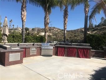 Great location in the Resort, close to front entrance, Pool, Market and Restaurant even Pickleball Courts. This Site has Built-In BBQ, Washer & Dryer, Freezer and Lighted Pilasters with Sitting Wall surrounding the Site. Great Island for entertaining and umbrellas to shade your activities. Huge area to park your Rig with lots of parking area. Looking for an RV Resort lot with space and privacy then come check out this perfect location nestled among the foothills of Palomar Mountain, minutes from Temecula Wine Country as well as a convenient location to Palm Springs in just under an hour, 1.5 hrs to San Diego and 1 hr to the beach in Oceanside. Rancho California RV Resort provides amenities such as a 14 hole Executive PAR 3 Golf Course (no fees for owners), 5 Pools/Jacuzzis, Tennis courts, Pickleball courts, Dog park, Club house, hiking trails, Horseshoe lawn and onsite grocery market. The resort is guard gated with no age restrictions. Monthly HOA fee includes use of the golf course, amenities, trash pickup at lot, water/sewer and common area maintenance. If you are considering a premier Southern California RV destination, don't miss out on visiting Rancho California RV Resort - Financing Available, schedule a showing today!