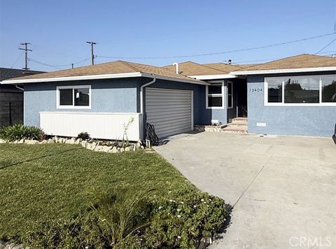 Photo of 13404 Purche Ave, Gardena, CA 90249 (MLS # SR26095424)