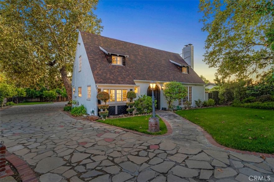 HISTORIC GATED ENGLISH CHÂTEAU ESTATE WITH GUEST HOUSE. Designed by C.T. Stover with redwood construction for the Pitzer College family circa 1929. Beautiful European Storybook architecture inside and out. Over 1/2 acre of picturesque grounds. Main home approx. 3,275 sq.ft. with 4 bedrooms & 3 baths (1 bedroom & 2 baths downstairs), primary master suite with fireplace, living room with fireplace, dining room, and huge Great family room (over 600 sqft) with impressive stone fireplace! Spacious, light-filled renovated kitchen with granite stone floors, Quartz countertops, self closing cabinets, and eating nook. Enjoy light neutral decor and extensive oak hardwood floors plus copper re-piping. Inside laundry. Approx. 840 sq.ft. Guest House / ADU with living room, kitchen, sleeping loft, & bath. Newer 3-car garage. Property boasts multiple patio areas, tranquil gardens, fruit trees, & fish pond. Additional private cul-de-sac property access also via Blue Mountain Way at south side. This location is truly ideal — enjoy easy access to Claremont’s top-rated schools, The Village’s shops and restaurants, local parks, hiking trails, and convenient freeway connections. Whether you’re looking for a move-in ready home or an investment opportunity, this amazing gem offers incredible versatility and value in one of Southern California’s most sought-after communities. Don't miss the 3D Property Video Tour!