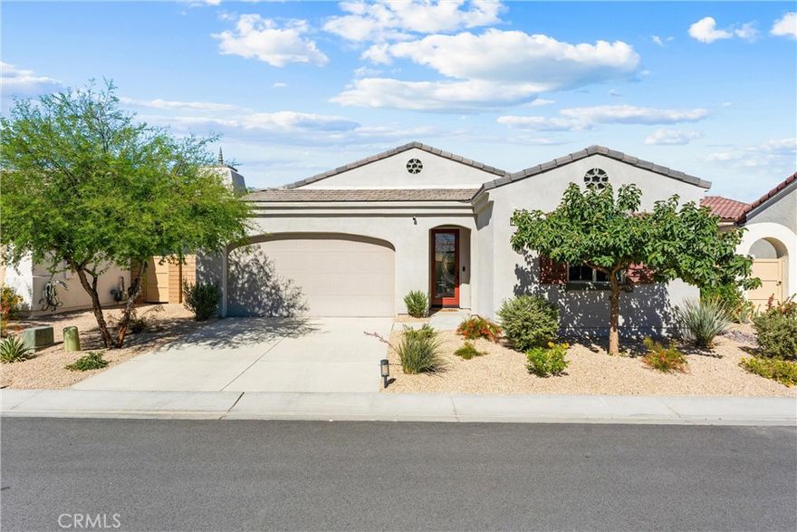 Welcome to your desert dream home! This beautifully upgraded single-story showplace with its own private pool with a baja self and umbrella providing that perfect lounge area offers incredible value and resort-style living in the highly sought-after 55+ gated community of Domani.

From the moment you open the custom front door, you’re greeted by natural light, stylish finishes, and an open, inviting layout. The modern kitchen features gorgeous cabinetry, stunning countertops, and a large island that seamlessly connects to the dining and living areas—perfect for entertaining or relaxing in style.

The spacious primary suite is a tranquil retreat with a beautifully upgraded, spa-inspired bathroom. A second bedroom, which is a junior primary suite with its own en-suite provides privacy for guests, while the den/office offers flexibility for work or hobbies. The custom-tiled powder room and inside laundry room complete this ideal floor plan.

Step outside to your own private oasis—complete with a sparkling custom pool, soothing water feature, and a covered outdoor lounge with a ceiling fan and TV for year-round enjoyment. The turf area is perfect for pets or even a personal putting green! The garage is finished with epoxy flooring and custom cabinetry for extra storage.

Enjoy all the resort-style amenities Domani has to offer, including a beautiful clubhouse, fitness center, pool, spa, outdoor lounge with fireplace and TV, outdoor seating area with a fire feature, dog park, pickleball, and bocce ball.

A spectacular home, with over $75,000 in upgrades, in a vibrant community—this is the one you’ve been waiting for!