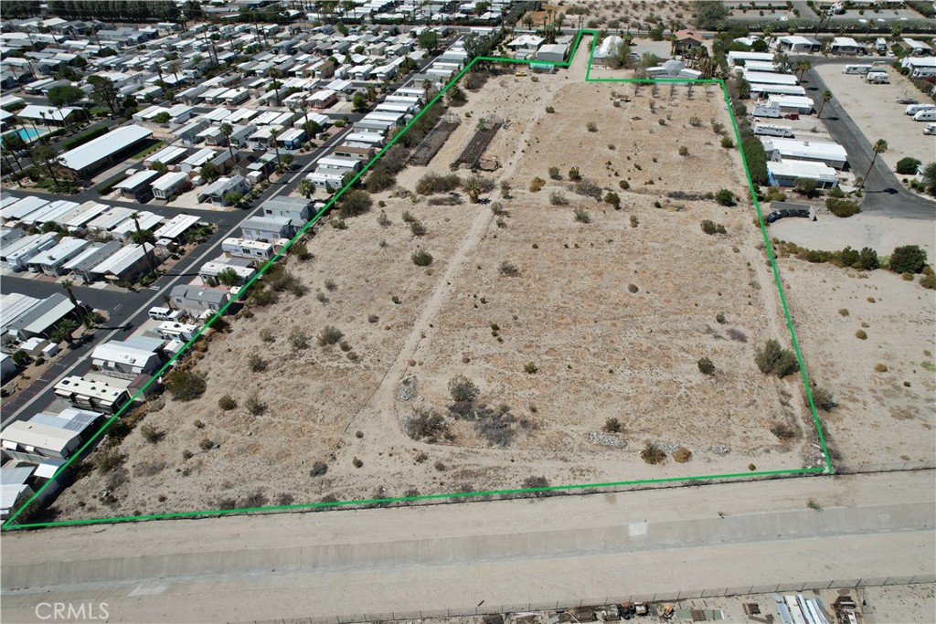Flat lot with mountain views.in Desert Hot Springs Mineral Hot Spring Water area with an active CUP on file for the development of a Mobile Home Park. Adjacent to serveral Mobile Home & RV Parks. It offers potential for development, recreation, or investment, whether for a private retreat, future home site, or long-term investment. Buyer and buyer's agent to verify all information with the city or county for allowable uses and requirements and rely on their own investigations. **Buyer responsible for checking zoning, utilities, permits and exact property boundaries. ****