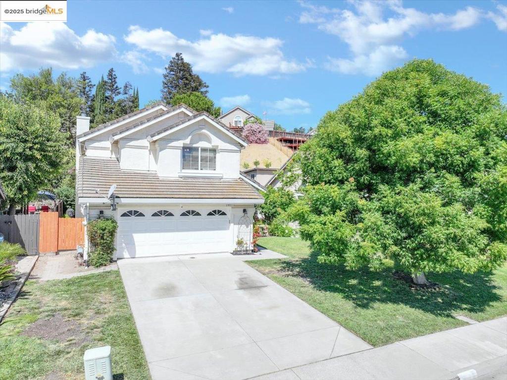 Tucked into the rolling hills of Antioch, 4011 Folsom Drive has everything you need — a spacious 4-bedroom, 3-bath home offering 2,448 sq ft of beautifully designed living space on a generous 0.28-acre lot. Nestled in a serene Antioch neighborhood, this two-story traditional home features soaring ceilings, abundant natural light, and seamless indoor-outdoor flow. The open-concept kitchen boasts white cabinetry, a central island and stainless appliances. Downstairs includes formal living/dining areas, a cozy family room with fireplace, laundry room, and optional office/bedroom. Upstairs, the private primary suite impresses with vaulted ceilings, a spa-like bath with new flooring, tub, and dual vanities. Two additional bedrooms, new carpet, and a built-in workspace add functionality. Step outside to a deep, private backyard with mature landscaping, fruit trees, patio, and no rear neighbors. Close to parks, schools, and Hwy 4 — this home offers the best of space, style, and location!