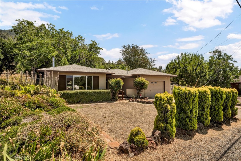 Charming 2-Bedroom Retreat with Private Backyard & Lake Access Amenities! Welcome to your peaceful escape! This beautifully maintained 2-bedroom, 1-bath home offers comfort, charm, and convenience in one of the most desirable neighborhoods in the area. Nestled in a quiet HOA community known for its breathtaking lake views and friendly neighbors, this property is the perfect blend of privacy and community. Step inside to a bright, open-concept living space filled with natural light. The cozy wood-burning stove creates a warm, inviting atmosphere—ideal for relaxing evenings or hosting guests. The two generously sized bedrooms each feature sliding glass doors that open directly to the fully fenced backyard, giving you seamless indoor-outdoor living. Enjoy your morning coffee or evening glass of wine in the private backyard oasis—peaceful, secluded, and perfect for entertaining or simply unwinding under the stars. This home is located in an HOA with an incredibly low annual fee of just $525, granting you access to top-notch amenities including a swimming pool, marina, and clubhouse.
