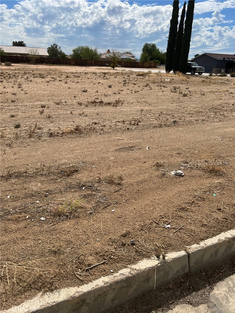 Commercial lot on Bear Valley Rd., high traffic area, utilities on street (buyer to verify) Great location for free standing building. Adjacent to 21101 Bear Valley Rd. Ideal for a variety of business opportunities.