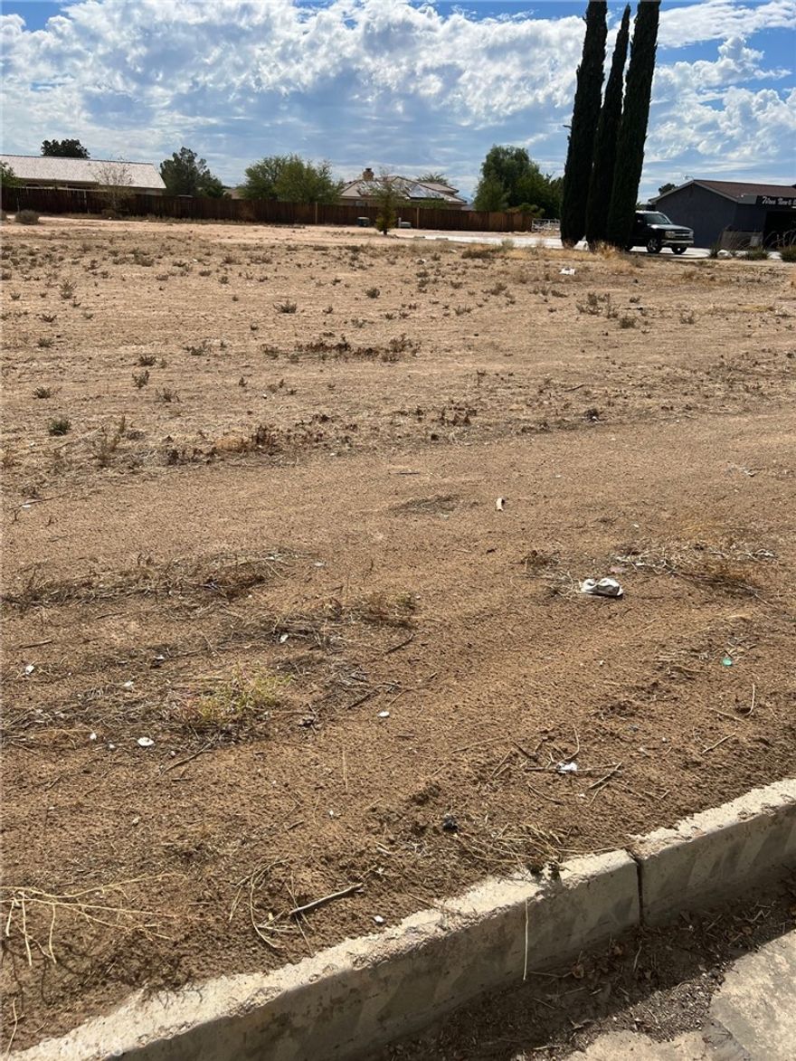 Commercial lot on Bear Valley Rd., high traffic area, utilities on street (buyer to verify) Great location for free standing building. Adjacent to 21101 Bear Valley Rd. Ideal for a variety of business opportunities.