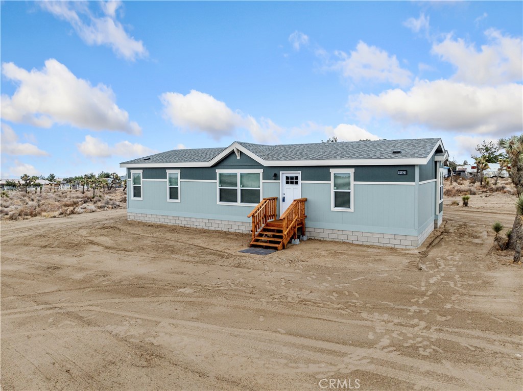 Step into this beautifully built 2025 Skyline manufactured home offering 1,404 sq ft of modern living space. Featuring 3 bedrooms and 2 bathrooms, the well-designed split floor plan provides both comfort and functionality. The home opens into a spacious great room, seamlessly connecting the living area, kitchen, and dining space—perfect for everyday living or entertaining. The expansive kitchen is equipped with abundant cabinetry, ample counter space, and brand new stainless steel appliances. A large laundry area adds even more convenience and storage options. On one side of the home, two bedrooms share a full bathroom. On the opposite side, the private primary suite features a walk-in closet and a roomy en-suite bathroom. Built by Skyline Homes, this property stands out with quality craftsmanship, including 2x6 exterior wall construction that provides a sturdier build and superior insulation. Situated on a flat, fully usable 2 acre lot, there’s plenty of room to add a detached garage, metal building, barn, horse corrals, or other improvements. Located in a peaceful rural neighborhood, the property offers quiet country living with easy access to Hwy 138 and Hwy 18. It’s also just minutes from a local elementary school and falls within the desirable Snow Line School District. Zoned for horses and priced under $400,000, this is an incredible opportunity to enjoy brand new construction with space to grow!