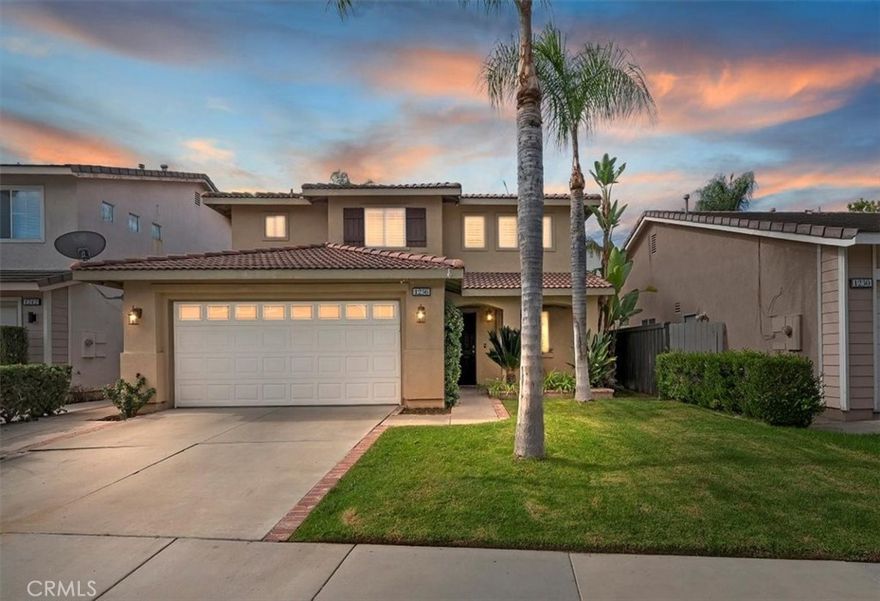 Welcome to this charming single family home nestled in a quiet gated community of Ashwood in South Corona.  Boasting a flexible floor plan and desirable features, this residence balances comfort and style.  With a blend of indoor and outdoor living spaces, this home is ideal for both entertaining and everyday living.  Features include 4 bedrooms and 3 baths with one of the bedrooms and baths downstairs.  Highlights include high vaulted ceilings upon entry with a very open-concept layout connecting the living, dining and kitchen areas - a fireplace in the family room adds warmth and ambiance.  Central cooling and heating provide year round comfort.  The rear yard offers much privacy with mature palm trees, a calming waterfall coming off the slope, and a private above ground spa to soak in and enjoy that glass of wine at the end of a long day. Situated in the 92881 zip code, this home in a well established location of South Corona, literally within 2 blocks of Santiago High School and Orange Elementary School - also close to shops, entertainment and nearby to both the Crossings and Dos Lagos.  Hurry on this one as it may not last.