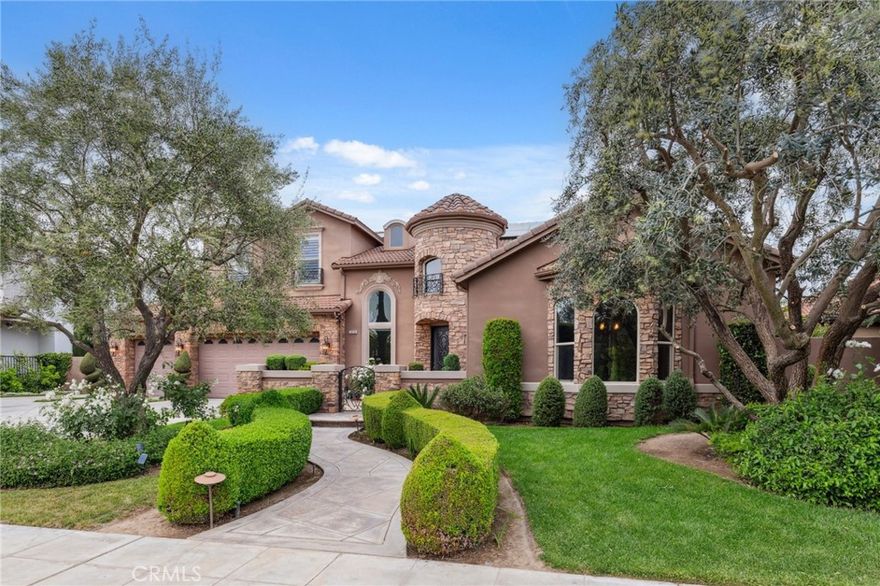 Spectacular McCaffrey custom home in the exclusive Bellaviera neighborhood, offering panoramic views of the Bluff, Lake San Joaquin River, Sierra Nevada mountains, and sparkling city lights. Enter through olive tree-lined cobblestone paths into a masterpiece of craftsmanship - soaring vaulted ceilings, large porcelain tile with stone inlay, wrought iron stair rails, and Dentil style crown molding & other custom features throughout. The gourmet kitchen features custom cabinetry, granite countertops, a convenient island breakfast bar, and a custom crafted range hood. The primary suite opens to a private balcony, the perfect spot to take in the breathtaking scenery. Designed for entertaining, the backyard showcases a built-in BBQ island, sparkling pool with a waterfall, majestic lion water features, and a charming gazebo dining area. Additional highlights include OWNED SOLAR, two heat pumps, RV/Boat parking, electric car charger, surround sound, and a lot size of nearly 1/3 acre. A rare blend of luxury, function, and unforgettable views - truly one of a kind!