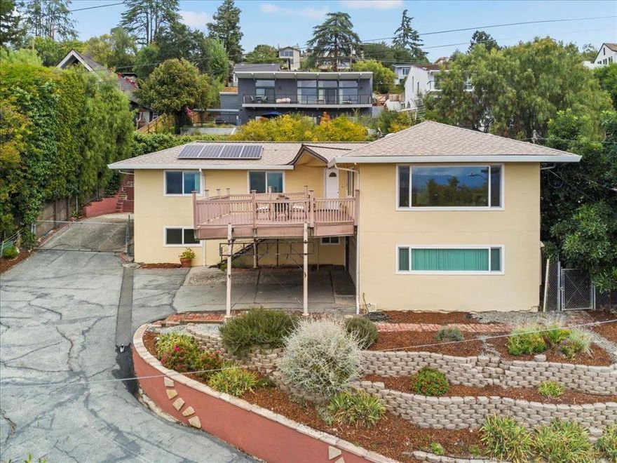 This gracious East Highlands home offers commanding views of the valley and San Jose Country Club golf course. Enjoy holiday fireworks from the front balcony or unwind by the midcentury fireplace. An updated kitchen featuring stainless appliances and handy island in the open concept living area makes entertaining easy!  The lower level is ideal for those with mobility challenges or can be converted into a separate unit. Owned solar panels means no big utility bills during warm summer months when the central air conditioning is essential.  You'll feel you're above it all, yet the home is just a few minutes from shopping and restaurants, plus it's a quick 20-minute commute to downtown San Jose.  Don't miss this opportunity to become part of the East Foothills community - San Jose's Best Kept Secret!