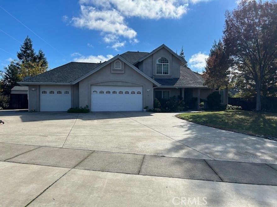 This contemporary, single-family home is located in a desirable neighborhood very near to upper Bidwell Park. is a 4-bedroom, 3-bathroom residence with 2,476 sq. ft. of living space, built in 2004, Lot size 0.54 ac.   The property features a 0.54-acre lot, granite counters, high ceilings, a two-way fireplace, a whole house fan, and an owned solar system. Additional features include a 3-car garage with RV access, a sprinkler system, and a patio. 4 total, with one on the main floor,  3 total (2 full, 1 half), Carpet and tile through all the house,  Features granite counters, a breakfast bar, and a gas/electric range. Includes a family room, a separate dining room, and a living room, Gas, two-way fireplace in the family room.   Walk-in closet, high ceilings, and a whole house fan.  3-car garage with a 2-door opener and RV access/parking, Brick and concrete patio,  Includes a garden, front and rear sprinklers with a timer, and a storm drain.  Seller-owned photovoltaic solar system.
