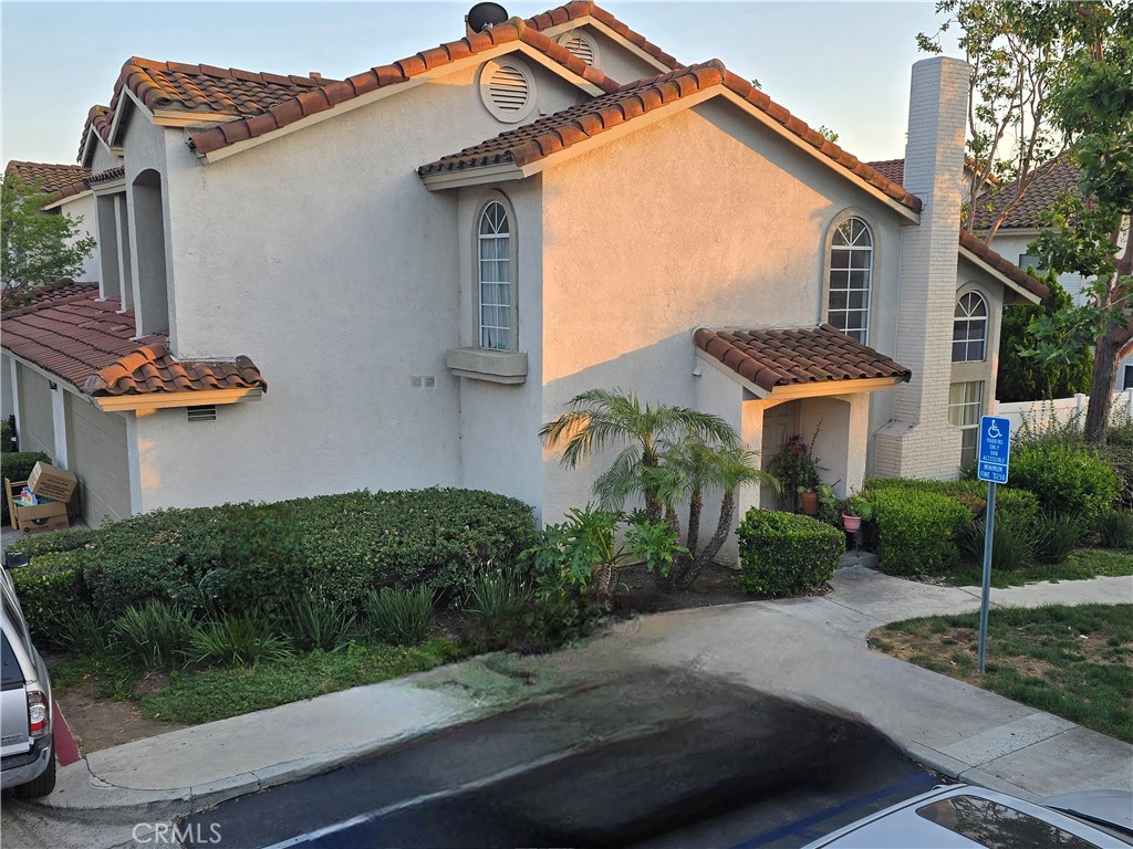 Rare opportunity to get into this spacious townhome and tastefully renovate on your own timeline! This layout on this mostly original 3 bed 2.5 bath townhouse maximizes all 1325sqft of living space. Vaulted ceilings can be appreciated from the upstairs landing area as you can overlook the living room and fireplace. The oversized garage has an additional space for full size washer/dryer. Laminate flooring downstairs, tile flooring in bathrooms and kitchen and carpeted bedrooms. Bring your own vision and taste to bring this up to date!!!