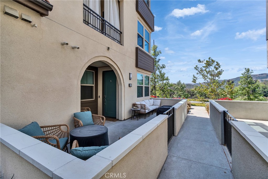Resort-style living within minutes to the beach! This first floor, ADA compliant, corner-unit condo has great natural light with unobstructed views of the beautiful hills across Cow Camp, and an oversized 1-car garage. A newly built unit with an open floor plan, upgraded LVP flooring, recessed lighting with dimmers, dual pane windows, and a large outdoor patio with mountain views. This smart home is equipped with owned solar panels, and a tankless water heater and a full sized stackable washer and dryer. Modern finishes such as soft close shaker cabinets, white quartz countertops, Wi-Fi enabled GE stainless steel oven range and a gas stove. The primary bedroom features an en-suite bathroom with dual vanity sinks, walk-in shower, and a walk-in closet. Secondary bedroom is adjacent to the second bath with a tub+shower combo. Don’t miss your chance to own this exceptional property in one of the most desirable communities in Rancho Mission Viejo! Exclusive to Rancho Mission Viejo residents are all of the state-of-the-art amenities in the Villages of Sendero, Esencia, Rienda and future Villages. There are community amenities for all from breath-taking resort-style pools including a 20,000 sq foot lagoon and lap pool and spas, Esencia school K-8, community farms, amazing fitness centers, guest house, putting green, bocce ball courts, tennis and pickle ball courts, playgrounds, coffee shop, fire pits, an arcade and so much more! There is plenty of open parking spaces in the community, and is conveniently located to Ortega Highway, the Toll Roads, and the 5 freeway.
