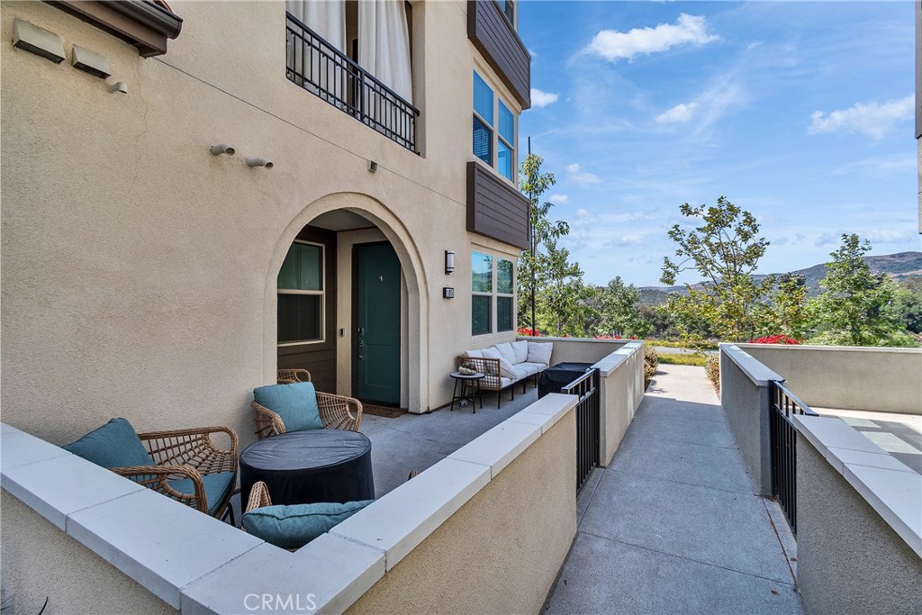 Resort-style living within minutes to the beach! This first floor, No stairs-ADA compliant, corner-unit condo has great natural light with unobstructed views of the beautiful hills across Cow Camp, and an oversized 1-car garage. A newly built unit with an open floor plan, upgraded LVP flooring, recessed lighting with dimmers, dual pane windows, and a large outdoor patio with mountain views. This smart home is equipped with owned solar panels, and a tankless water heater and a full sized stackable washer and dryer. Modern finishes such as soft close shaker cabinets, white quartz countertops, Wi-Fi enabled GE stainless steel oven range and a gas stove. The primary bedroom features an en-suite bathroom with dual vanity sinks, walk-in shower, and a walk-in closet. Secondary bedroom is adjacent to the second bath with a tub+shower combo. Don’t miss your chance to own this exceptional property in one of the most desirable communities in Rancho Mission Viejo! Exclusive to Rancho Mission Viejo residents are all of the state-of-the-art amenities in the Villages of Sendero, Esencia, Rienda and future Villages. There are community amenities for all from breath-taking resort-style pools including a 20,000 sq foot lagoon and lap pool and spas, Esencia school K-8, community farms, amazing fitness centers, guest house, putting green, bocce ball courts, tennis and pickle ball courts, playgrounds, coffee shop, fire pits, an arcade and so much more! There is plenty of open parking spaces in the community, and is conveniently located to Ortega Highway, the Toll Roads, and the 5 freeway.