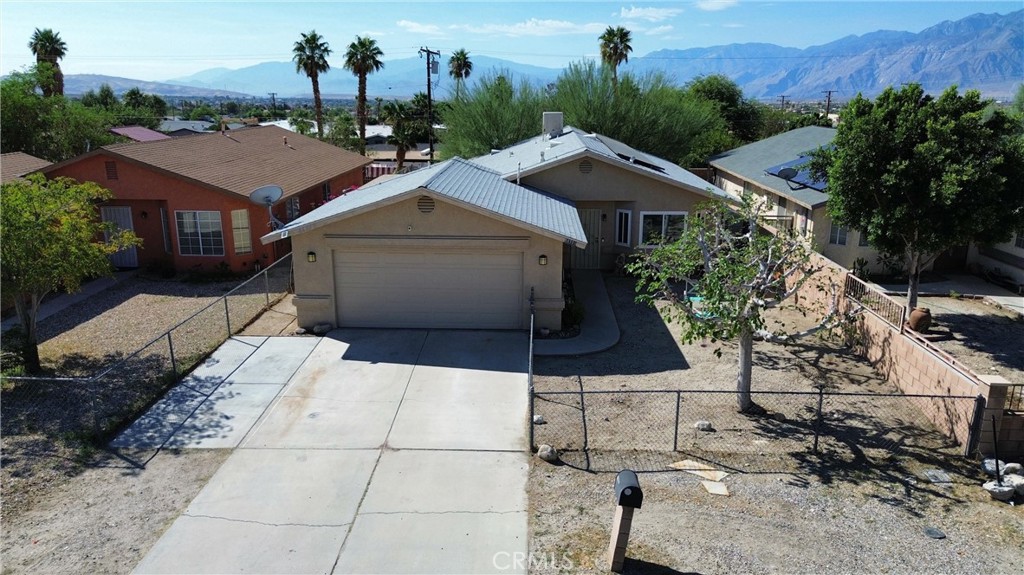 EXCEPTIONAL VALUE IN DESERT HOT SPRINGS - MOVE-IN READY WITH INCREDIBLE SAVINGS!
Discover this well-maintained starter home that offers both affordability and modern efficiency in the heart of Desert Hot Springs. Priced competitively and qualifying for zero-down financing programs, this property presents an outstanding opportunity for first-time buyers or savvy investors.
Energy Efficiency at its Finest: Enjoy minimal utility costs with the fully owned and paid-off solar system, complemented by recently upgraded windows throughout the home for maximum energy savings.
This home offers practical modern amenities including a two-car garage with convenient EV charging station and a private enclosed front yard that provides both security and enhanced curb appeal. The spacious backyard showcases stunning mountain views and features a covered patio that's perfect for year-round outdoor entertaining. With quality maintenance evident throughout, this property is truly move-in ready for its new owners.
Take advantage of easy freeway access placing you minutes from Palm Springs' renowned dining, shopping, and entertainment scene. Adventure seekers will appreciate being less than an hour from Joshua Tree National Park, while remaining just two hours from both San Diego and Los Angeles. Music lovers can easily access Indio's world-famous festivals in just 30 minutes.
This rare combination of affordability, efficiency, and location won't last long in today's market. Schedule your private showing today and see why this Desert Hot Springs gem is the perfect place to call home!