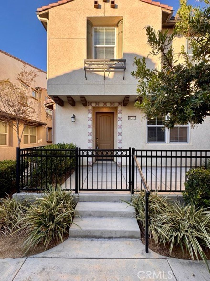 This beautiful two story condominium is located in the highly sought-after community of Arroyo Vista. Enjoy privacy and relaxation in your gated courtyard. Enter inside to an open-concept living room and kitchen featuring stunning upgraded plank flooring throughout the first level. The kitchen is equipped with dark wood cabinetry, granite countertops, and stainless steel appliances, perfect for both everyday living and entertaining. Additionally, you will find a bathroom as well as storage on the main level. Upstairs, you'll find three spacious bedrooms, a versatile loft, and a convenient laundry room. The expansive primary suite is filled with natural light and includes an ensuite bathroom with dual sinks, a separate soaking tub and shower, and a large walk-in closet. Additional features include an attached two-car garage and a tankless water heater for energy efficiency. Residents of Arroyo Vista enjoy access to fantastic community amenities such as a recreation center, pool, spa, cabanas, outdoor fireplace, BBQ area, fire pit, and more!