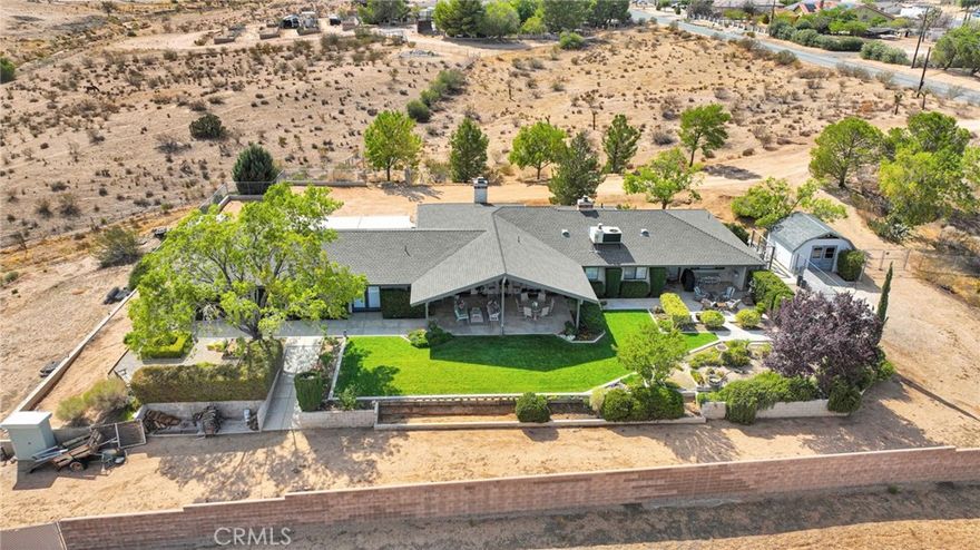 Welcome home to this beautifully maintained 3 bedroom, 2.5 bathroom residence offering over 2,600 sq. ft. of living space on a sprawling 3.56-acre lot. Perfectly designed for comfort and function, this property combines country charm with modern living.



Step inside to find a spacious floor plan with a bright, open living area that takes in breathtaking 180° views of the mountains and desert. The kitchen and dining areas flow seamlessly into a large bonus room, ideal for a game room, home gym, or additional family room—the options are endless!



Outside, you’ll find lush, mature landscaping, a shed, and a chicken coop, offering a true rural lifestyle while remaining close to town amenities. The property is fully usable and horse-friendly, with plenty of room for corrals, an arena, or additional outbuildings.



Experience peace, privacy, and expansive views—all from your own backyard. This is the desert lifestyle at its finest!