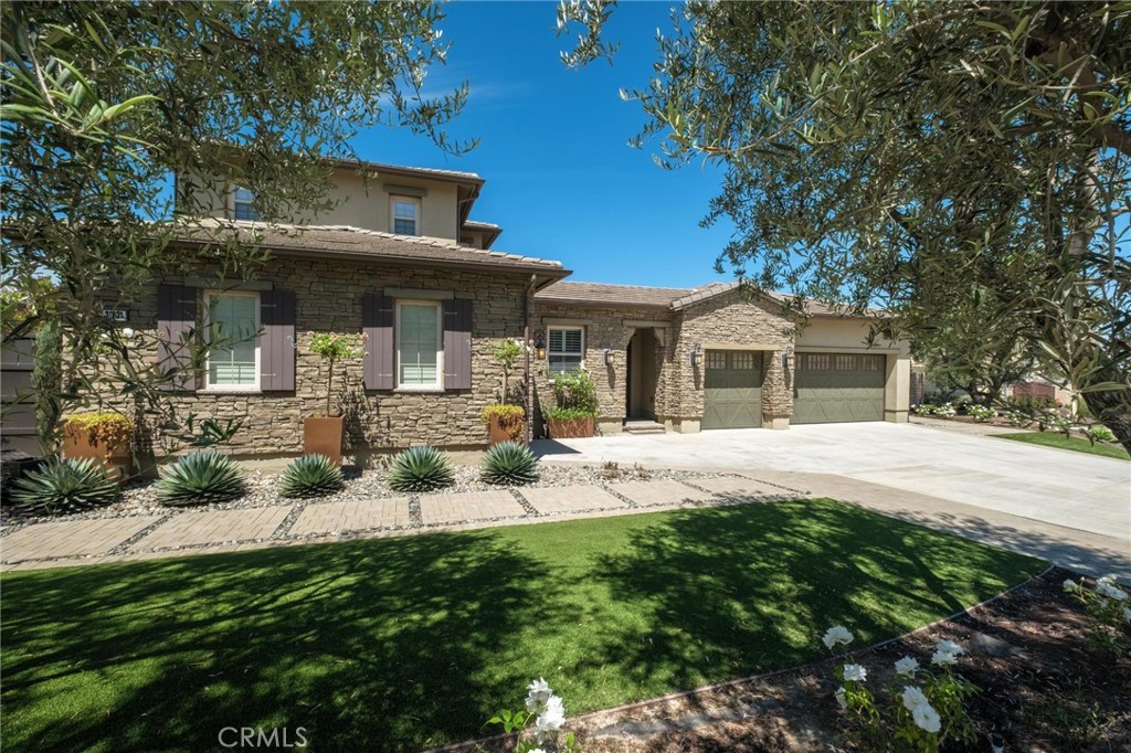 Welcome to Via Granada – Where Luxury Meets Functionality! Discover this stunning
4-bedroom home with loft, theatre room (or optional 5th bedroom), and 3.5 baths,
perfectly designed for modern living and ultimate comfort. Step inside to a spacious
main-level primary suite, complete with a spa-inspired bath featuring a soaking tub,
oversized shower, and custom built-in closet. The chef’s kitchen is a dream with
premium KitchenAid appliances—dual oven range, built-in refrigerator, microwave,
dishwasher, trash compactor—and a walk-in pantry. A reverse osmosis system ensures
fresh, purified water at all times. Enjoy endless possibilities for entertaining! The
dedicated theatre room comes equipped with built-in speakers, screen, and receiver,
while the upstairs loft with wet bar offers another perfect space for gatherings. The great
room features disappearing doors that seamlessly open to a resort-style backyard,
creating the ultimate indoor-outdoor flow. Your private backyard oasis boasts a covered
outdoor room with fireplace, built-in grill, hibachi station, warming drawer, ice chest,
putting green, and bocce ball court—perfect for hosting and relaxing in style. Additional
highlights include: Dual-zone A/C & dual tankless water heaters, solar panels & EV pre-
wiring, central vacuum system, oversized laundry room with secondary fridge, 3-car
garage plus separate 1-car garage with 220 electrical in both, upgraded electrical
system throughout. Every detail of this home blends luxury, functionality, and energy
efficiency—making it move-in ready for your next chapter. Don’t miss this rare
opportunity to own one of San Juan Capistrano’s most desirable homes!