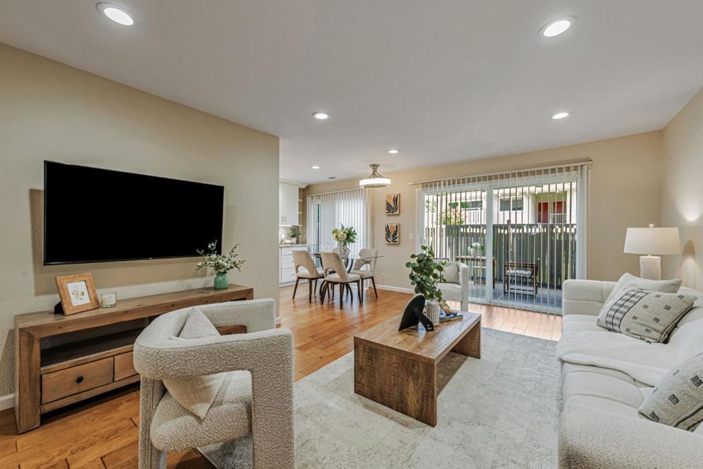 Move in ready! This beautifully remodeled 2-bedroom, 1-bathroom condo offers a blend of contemporary design and functional upgrades. Engineered hardwood flooring throughout, recessed lighting, smart thermostat and light switches, large living room with sliding doors to beautiful patio. The kitchen is a chef's delight, featuring granite countertop, ample cabinet space, full slab backsplash, high-end Bosch & Thermador appliances, Grohe faucets, and built-in RO water filter. Luxurious bathroom with double vanity sink, granite countertops, and shower stall with marble tiles. Washlet-ready toilet. Detached carport including a large storage unit. Desirable complex complete with swimming pool, sauna, gym, club house, and plenty of guest parking throughout the complex. Next to Mtn View community center and within 5 minutes drive to Whole Foods, Costco, San Antonio Center shopping mall, downtown Mountain View, and Caltrain station.