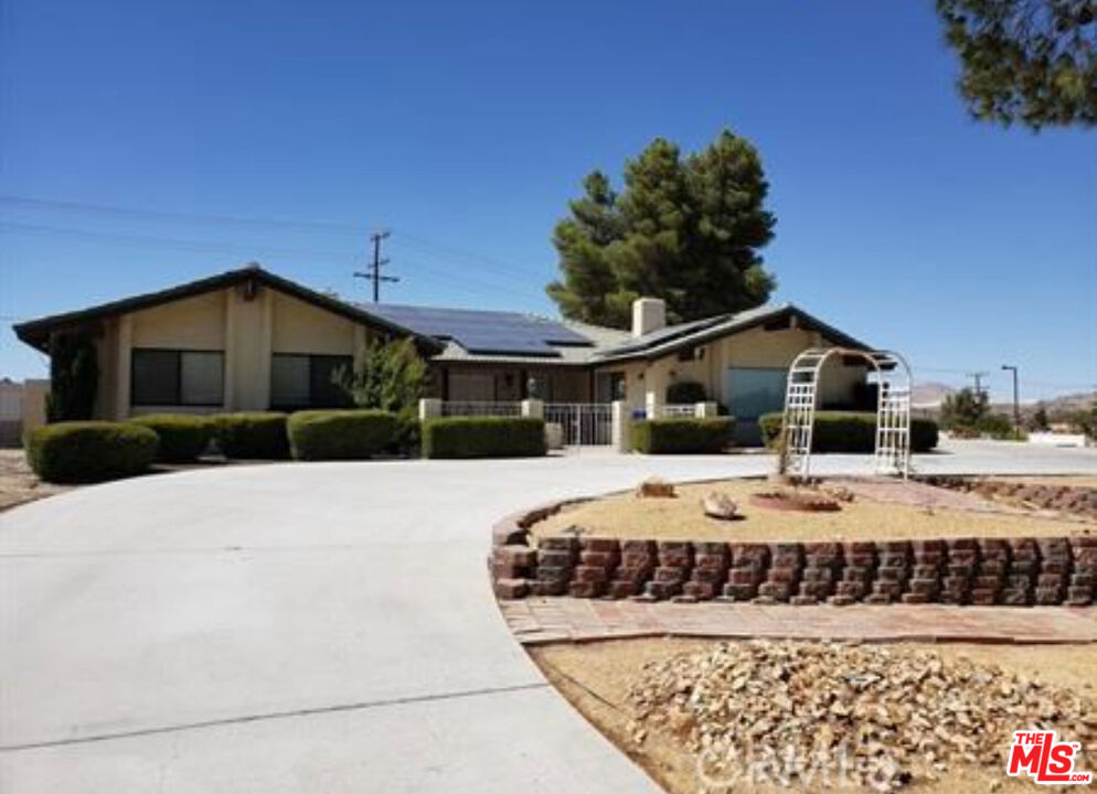 This Beautifully Upgraded Solar Powered Apple Valley Home Offers 5 Bedrooms, 3 Baths with a Formal Living Room with a Fireplace, a Family Room with a Fireplace and a Large Den!!! It offers a formal dining room, full laundry room, solar lease (no additional monthly payment), a Large Swimming Pool that has been recently plastered. In addition it sits on a 1 acre lot!!! Ideal for RV/Boat Parking, storage and much more!!!
