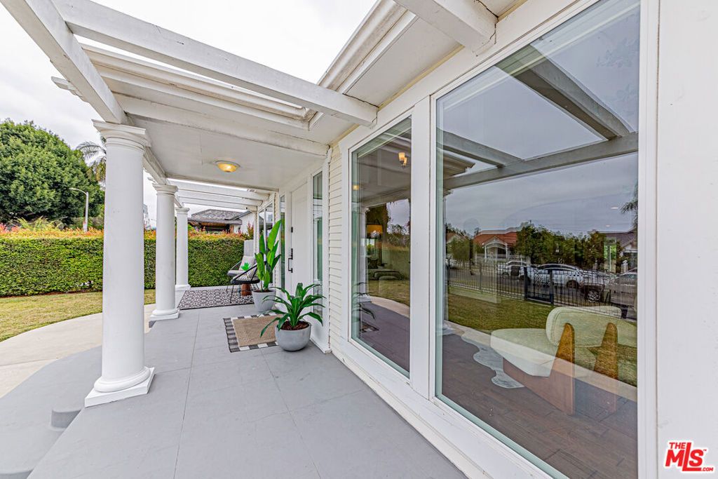 Photo of 1042 3rd Avenue, Los Angeles, CA 90019 (MLS # 26838593)