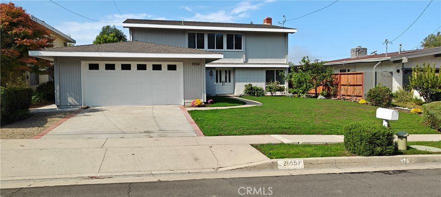 Beautiful Los Verdes 5 bedroom home, LARGE landscaped FLAT backyard with rearward OCEAN VIEW. . New interior and exterior paint.  New tile and wood-grain textured vinyl flooring through out. Double-pane vinyl windows and patio doors. Kitchen has Quartz Counter tops, breakfast nook. Formal Dining Room. Living Room and Kitchen have patio doors open to back yard. Fireplace in living room. Remodeled first floor powder room.  Direct access from 2-car garage to family room. Family room opens to kitchen.  Second Floor has 5 good-sized bedrooms. Master bedroom and one other bedroom have nice ocean view. Remodeled hallway bathroom and master bathroom. Very bright and spacious. Walk to Vista Grande Elementary School. Copper freshwater plumbing. In-wall portion of kitchen wastewater system replaced with  ABS plastic. Clean-out access installed.