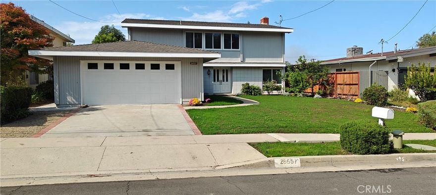 Beautiful Los Verdes 5 bedroom home, LARGE landscaped FLAT backyard with rearward OCEAN VIEW. . New interior and exterior paint.  New tile and wood-grain textured vinyl flooring through out. Double-pane vinyl windows and patio doors. Kitchen has Quartz Counter tops, breakfast nook. Formal Dining Room. Living Room and Kitchen have patio doors open to back yard. Fireplace in living room. Remodeled first floor powder room.  Direct access from 2-car garage to family room. Family room opens to kitchen.  Second Floor has 5 good-sized bedrooms. Master bedroom and one other bedroom have nice ocean view. Remodeled hallway bathroom and master bathroom. Very bright and spacious. Walk to Vista Grande Elementary School. Copper freshwater plumbing. In-wall portion of kitchen wastewater system replaced with  ABS plastic. Clean-out access installed.