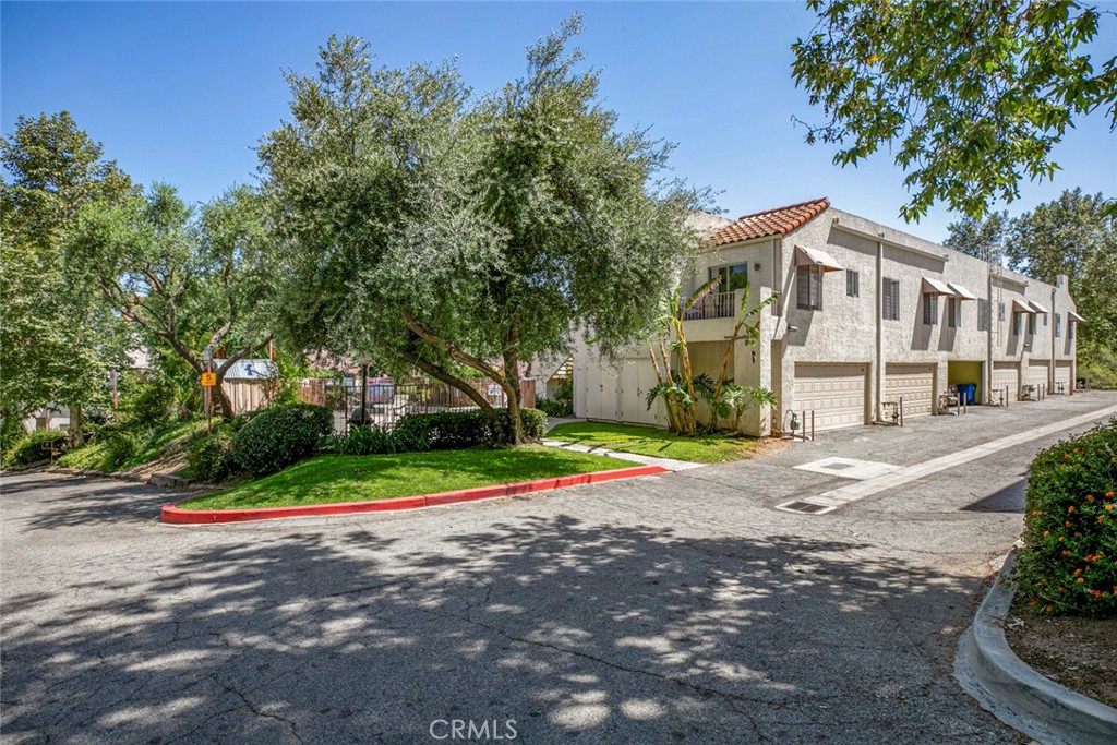 Welcome to this beautifully upgraded townhome offering comfort, style, and versatility in the heart of Pacoima. This spacious two-bedroom, two-and-a-half-bathroom residence features a thoughtful layout with en-suite bathrooms in both bedrooms, making it ideal for privacy and convenience. The primary suite boasts its own private balcony, and the secondary bedroom also enjoys balcony access — one of three balconies plus a charming private patio, perfect for entertaining or relaxing.
A bonus room adds flexibility for a home office, gym, or guest space, while recent upgrades throughout the home enhance its appeal and functionality. From the modern finishes to the well-maintained common areas, this townhome offers a turnkey opportunity in a secure, gated community with pool and spa.
Don’t miss the chance to own a beautifully maintained home with abundant natural light, multiple outdoor spaces, and a highly livable floor plan.