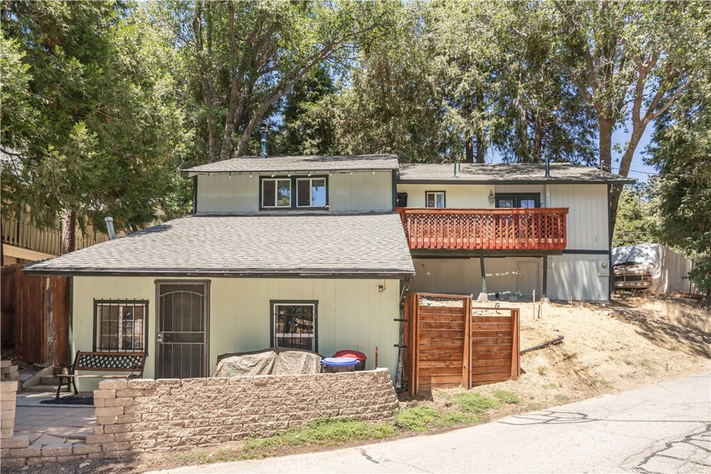 Discover the welcoming charm of 519 South Dart Canyon Road in Crestline, CA, where casual comfort meets modern living. This 1,721 square foot home is perfect for those who love relaxing in a cozy setting with all the right features.
Inside, you'll find a bright and airy space with dual-pane windows offering peaceful views of the surrounding woods. The kitchen and dining area are perfect for everyday meals or casual get-togethers, featuring a handy range, stove, dishwasher, and microwave, all set against stylish tile floors.
With three comfortable bedrooms, 1.75 baths, a downstairs den/bedroom, and additional loft/office space, there’s plenty of room for everyone to unwind. Each space is thoughtfully laid out to ensure a relaxing atmosphere. The downstairs den with its own entrance, loft, and bathroom could be separated to create an additional living space.
Outside, the fenced yard and deck is a great spot to kick back and enjoy the fresh air, while the included parking makes life easy. Situated on a 3,485 square foot lot, this home offers a laid-back lifestyle with modern perks. It's an inviting spot to enjoy everything Crestline has to offer!