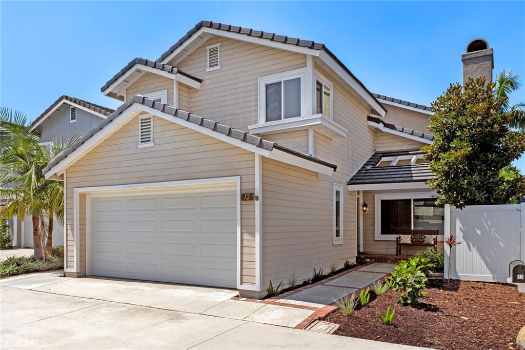 Experience the Irvine lifestyle in this move-in-ready, detached, Briarglen home in the village of Woodbridge. Located inside Yale Loop near South Lake Lagoon & Beach Club the residence enhances carefree living with no mello roos, low HOA dues, an open floorplan, extensive natural light, and a rare homesite with nobody directly behind creating unique openness and privacy in the spacious backyard. New upgrades and improvements include a new tile roof approx 2 years old, upgraded HVAC approx 5 years old, remodeled kitchen, remodeled master shower, newer energy-efficient windows and sliding-glass doors throughout, replaced garage door, and new on-trend lighting fixtures, interior paint and second-floor carpet. A custom brick entry patio complements the welcoming traditional-style home, which presents three bedrooms and two- and one-half baths in approx 1,786 square feet. White, light and airy, the interior reveals a fireplace-warmed living room with vaulted double-height ceiling, a formal dining room opening to the spacious side yard, and a family room that flows to the backyard and kitchen. Enjoy casual dining in the light filled breakfast nook and an upgraded kitchen which features quartz countertops, full tile backsplash, upgraded cabinetry and appliances, built-in pantry, a tray ceiling with crown molding, and window with views of backyard. Open, sunny, and private the backyard is extra spacious, offering generous room for relaxation, gardening, special celebrations and more, with no neighbor behind the openness and privacy in the backyard are unique within the neighborhood. The upper level hosts both secondary bedrooms and the primary suite, which is highlighted by a vaulted ceiling, walk-in and traditional closets with mirrored wardrobe doors, two sinks, and a remodeled shower with frameless glass doors and tile surround. Tile flooring is featured on the first level, and an interior laundry room and attached two-car garage with updated roll-up door enrich convenience. Enjoy this wonderful Irvine Woodbridge location with the Briarglen neighborhood located right next to the picturesque South Lake, walkable to Springbrook Elementary, Briarglen Park & Pool and just moments from North Lake, Woodbridge High School, shopping and dining at Woodbridge Village Center, Beach Clubs and Lagoons at Both Lakes, tennis courts, 22 swimming pools and countless parks. The popular Tanaka Farms is nearby, and UCI, Oak Creek Golf Club and Gelson’s are minutes away.