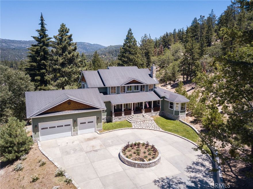 Amazing privately gated mountain estate situated on 3.5 secluded acres of Rimwood Ranch! Secured entry with intercom, grants access to the expansive drive. The main house displays features copper roof, natural stone, hardwoods and wrap around porches. Elegant formal entrance with custom tile and decorative columns. Comfortable den with fireplace and custom built ins. Formal dining with distant forest views. Living room boasts soaring ceilings and an impressive natural rock fireplace. Entertainers kitchen with custom cabinetry, granite counters, breakfast nook and prep sink. Spacious master quarters on main level with large walk in closets, 2 powder baths, double shower and spa tub. 4 bedrooms. 1,200 Sqft office with separate entry and driveway. Detached guest quarters with 2 separate apartments, oversized garage, covered RV parking and hook ups. Seclusion and outdoor options galore!  Property is a very profitable Airbnb rental and can provide a good source of income.