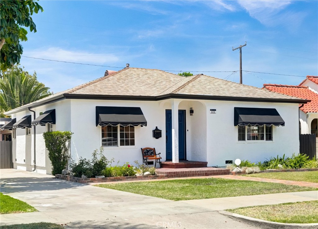 This stunning, spacious, exquisite remodel in the heart of Anaheim's Historic Colony District presents as a masterpiece of modern elegance and comfort, representing the best this idyllic neighborhood has to offer. Delightful in every detail, its spacious and open-concept layout flows beautifully throughout, the fully renovated kitchen a showpiece of Scandinavian charm, featuring Swedish design accents and a luxurious Carrara marble backsplash. Glistening modern appliances are complemented by gleaming new quartz countertops, a thoughtfully integrated coffee bar, and a beverage and wine cooler for effortless entertaining and everyday indulgence. Recessed lighting, new flooring, and refined detailing form a cohesive aesthetic that’s truly a feast for the eyes. And the expansive Great Room steals the show—perfectly suited for gatherings or serene evenings in—while three spacious bedrooms and two full baths offer privacy and comfort. The third bedroom, with its own private entrance, is ideal as a potential ADU or mother-in-law quarters, making it a versatile asset to this exceptional home. A large, covered carport, detached garage, and extended driveway provide ample parking. Conveniently located within walking distance to Pearson Park and renowned Anaheim Packing District, just two miles from Disneyland. Quick access to freeways, public transit, and the entertainment district. Don't wait--This beautiful home can only belong to one lucky buyer!