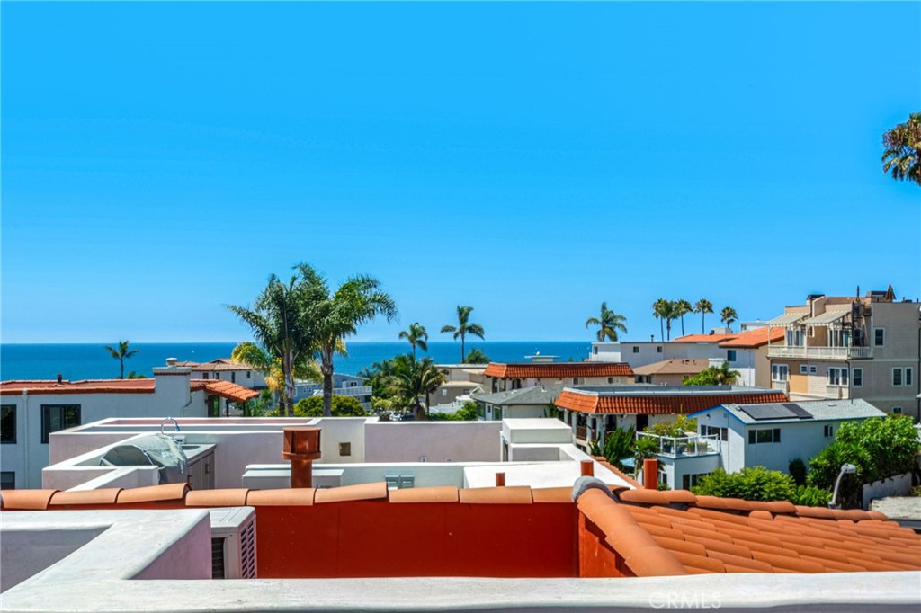 Experience elevated coastal living in the heart of San Clemente’s coveted Pier Bowl. Designed by renowned local architect Michael Luna, this brand-new luxury townhome pairs ocean and village views with refined modern design, a private elevator, solar power, and a rooftop deck crafted for entertaining.
The ground level features a spacious two-car garage, welcoming entry, laundry room, and bathroom. Upstairs, the main level is designed for gatherings, with a fireplace-warmed living room, expansive windows, and accordion glass doors that open to a view deck. A dedicated dining area connects seamlessly to the chef’s kitchen—appointed with abundant white cabinetry, quartzite countertops, a dry bar with wine fridge, a large island with bar seating, and top-tier Wolf and Sub-Zero appliances—while a private office and adjacent bathroom add flexible functionality.
On the upper level, two secondary bedrooms share a sleek full bath, while the primary suite impresses with a private view deck, generous walk-in closet, and spa-inspired bath with dual vanities and a large walk-in shower. Crowning the residence, a rooftop deck captures panoramic coastal views and is appointed with a fireplace, outdoor kitchenette with BBQ, and prep sink—perfect for entertaining under the stars.
With approximately 2,679 square feet of thoughtfully designed living space, this modern home delivers the ultimate blend of luxury, sustainability, and convenience—just moments from the sand, San Clemente Pier, and the vibrant shops and dining along Avenida Del Mar.