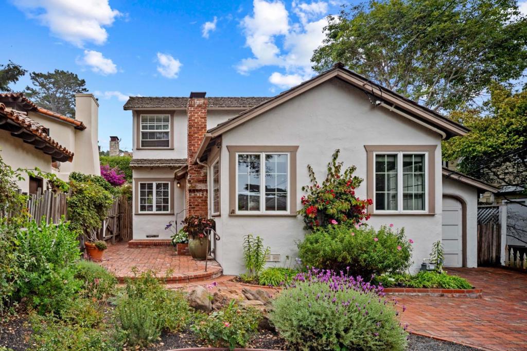 Welcome to Landfall, a true Carmel cottage with all the warmth and delights of a home much loved. With its roomy living/dining space complete with open ceiling, original white oak floors, and brick fireplace you can easily imagine the joys of friendship and family shared here. This 3 bedroom, 2 bathroom home located in a prime location just off Ocean Ave and less than two blocks to the beach offers perfect proximity to the magic of early morning beach strolls and the awe of Carmel sunsets. Open the windows and listen to the crashing waves or relax in the sun on the large upstairs deck. Make your way to the lovely back garden with some of the biggest hydrangea blooms in town and gather with friends around the stone fireplace on those chilly summer evenings. Landfall is everything Carmel is meant to be.