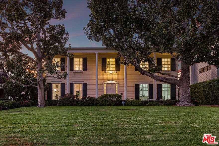 Located on one of the best streets in the Beverly Hills Flats, this beautifully reimagined 5 bedroom, 4.5 bathroom estate blends timeless elegance with modern comfort. Behind mature trees and a gated entry, the home opens to sun-filled interiors, generous volumes, and a spectacular indoor and outdoor flow that defines modern Beverly Hills living.Four spacious bedrooms are upstairs, including two primary suites with serene outlooks and spa inspired bathrooms, while a fifth bedroom downstairs offers ideal flexibility for guests or staff. All rooms are large and inviting, highlighted by a refined living room, formal dining room, sunlit library, and a brand new chef's kitchen with a statement island, top tier appliances, and abundant space for cooking, gathering, and entertaining. Outdoors, the property showcases a deep, private lot framed by lush landscaping and a sun lit grassy backyard, creating a tranquil backdrop for the lap pool, spa, lounge areas, and effortless entertaining. Impressive, warm, and exceptionally private, this residence is just 2 minutes from the finest shopping, dining, schools, and services Beverly Hills has to offer.