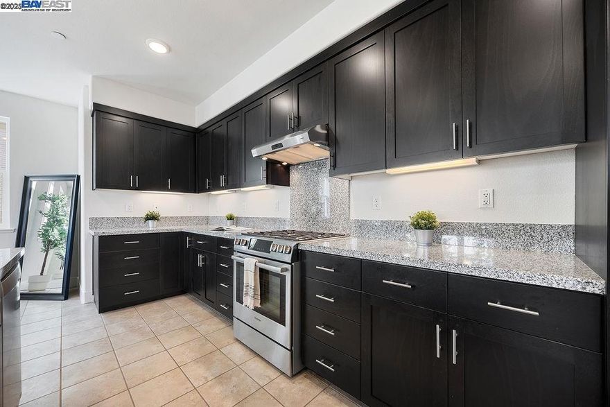 Discover comfortable modern living in the heart of Alameda Landing— a tri-level townhome-style condo that effortlessly blends sophisticated design, generous space, and everyday convenience. Lovingly maintained and move-in ready, this 3-bedroom, 2.5-bath residence spans 2,303 sq. ft. of bright, contemporary living just minutes from waterfront trails, shopping, and dining.  Enter through a welcoming first floor with storage closet and direct access to a spacious two-car garage, before ascending to the open-concept main level - where sunlight illuminates an open-concept Great Room perfect for effortless entertaining. The chef-inspired kitchen shines with stainless steel appliances, sleek granite counters, an eat-in island, and abundant cabinetry, while the adjacent dining area and private balcony create an easy flow for relaxing or entertaining.   Outside your door, life at Alameda Landing means effortless access to everything—Target, Safeway and popular eateries are just minutes away. Enjoy waterfront trails, community parks, and the local business favorites of Webster Street. Commuting is effortless with easy access to the Alameda Ferry, HWY 880, and Oakland Airport.