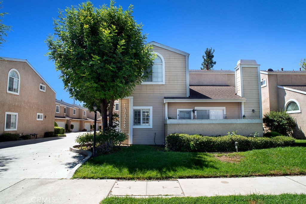 Rare FHA & VA approved community! One of the few units with no shared walls, offering privacy and the feel of a single-family home. Inside, discover soaring ceilings, wood floors, and a cozy fireplace filled with natural light. The remodeled kitchen shines with quartz counters, stainless appliances, and a sleek backsplash. The super-sized primary suite is a true retreat, complete with vaulted ceilings, space for a sitting area, and a large walk-in closet. Stylishly upgraded bathrooms, a private patio perfect for entertaining, attached 2-car garage, and access to a sparkling community pool complete this exceptional home. Move-in ready and truly one of a kind!