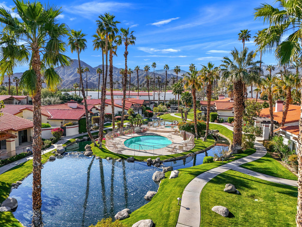 Welcome to your dream desert home in Los Lagos--Indian Wells premier gated community! Los Lagos was started in 1980 on 35 acres. The 89 beautiful custom homes were designed by renowned architect Barry Berkus. This single-level gem offers 3 bedrooms (including 2 en suites) and 3 baths in nearly 3,000 sq ft of open, modern living. This home is situated on a tranquil interior cul-de-sac. Step into a soaring vaulted ceiling with crisp white beams, a newly remodeled gourmet kitchen, fresh tile floors, and a grand fireplace. Every detail shines--from a newer roof (2022) to a newly painted interior (2025)- and there is still opportunity to add value. The expansive private backyard, with mature landscaping and fruit trees, invites outdoor gatherings and quiet relaxation. Los Lagos is a charming oasis in the desert that offers its residents a lush and peaceful setting, beautiful grand entry with lakes and fountains, amidst beautiful meandering streams, greenbelts, bridges, pathways, palm trees, colorful flowers and occasional visits from the ducks and egrets. Enjoy community living with access to four pools, spas, pickleball courts, and scenic walking paths--all minutes and walking distance from shopping and dining. Indian Wells residents enjoy golf, $50 to $35, free Grand Hyatt Fitness Center use and many City discounts. This unfurnished home is ready for you to enjoy desert luxury at its finest. PLEASE NOTE: the home is currently UNFURNISHED