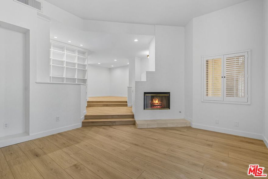 Welcome to this spacious and newly remodeled townhome offering approximately 1,800 square feet of bright, modern living. With an attached private two-car garage and thoughtful upgrades throughout, this residence combines comfort, style, and convenience in one of the most desirable locations. The interior has been beautifully updated with new flooring, energy-efficient windows, modern light fixtures, and central air conditioning. A sleek, renovated kitchen and updated bathrooms elevate the home, while the abundance of storage and an in-unit washer and dryer provide everyday ease. The layout features two bedrooms, including an extra-large primary suite with a cozy fireplace, as well as a versatile basement bonus room that can serve as a home office, gym, play room or all three. Three private patios create the perfect indoor-outdoor flow. Set within a community surrounded by mature trees and lush landscaping, residents enjoy access to a sparkling swimming pool, relaxing spa, and a well-maintained tennis court. The prime location offers close proximity to two elementary schools and is just a mile from Ventura Boulevard, where you'll find a wide array of restaurants, gyms, grocery stores, and essential conveniences, along with quick access to the 101 Freeway. Blending modern upgrades, generous space, and resort-style amenities, this townhome is move-in ready and perfectly positioned for the lifestyle you've been looking for.